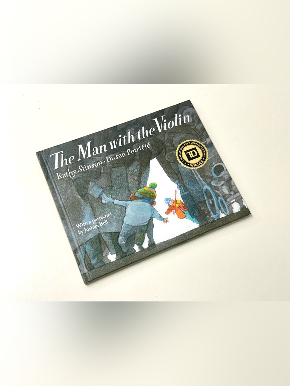 THE MAN WITH THE VIOLIN Hardcover Book by Kathy Stinson